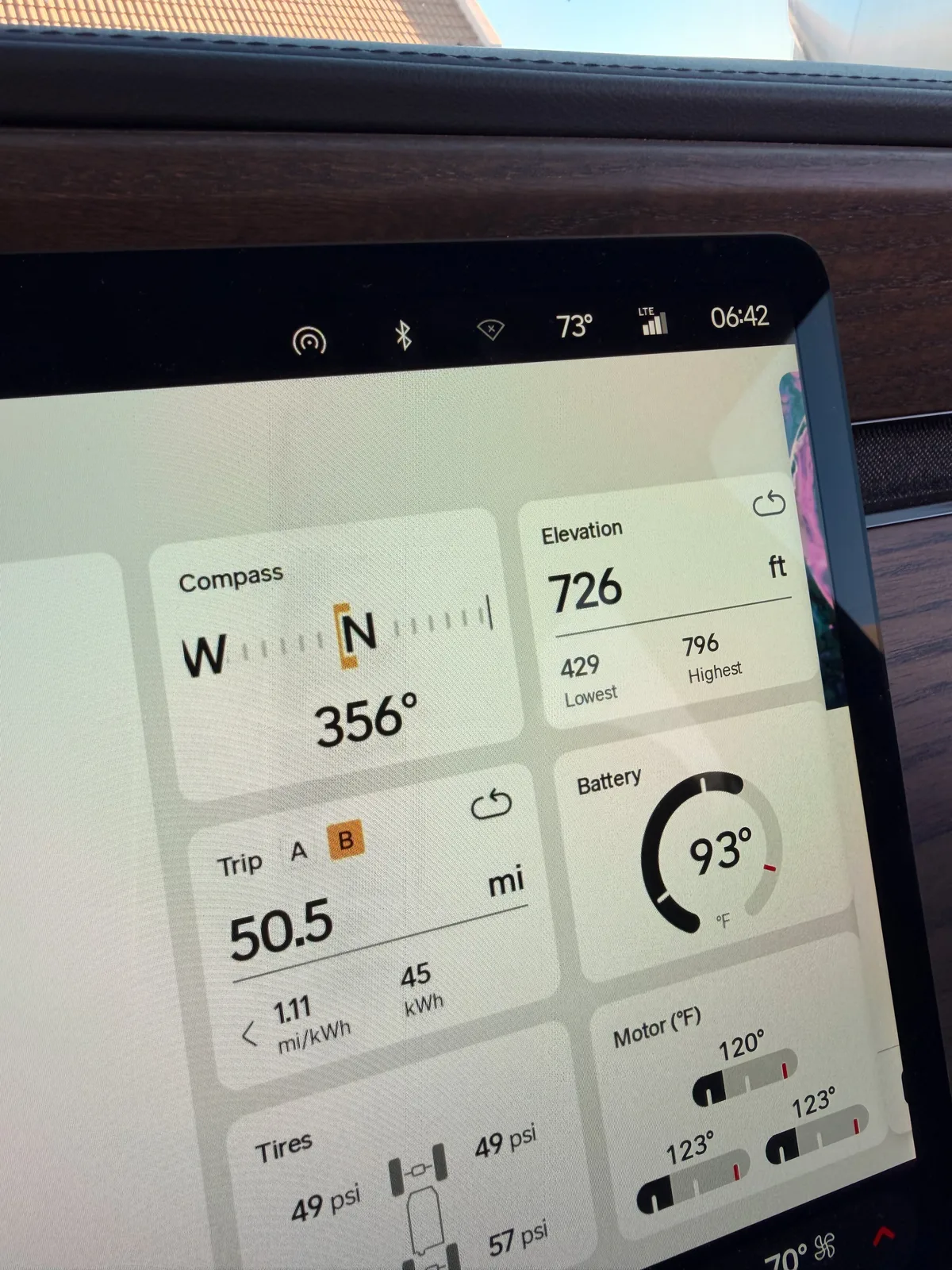 The Rivian R1T's center display close-up at Gila Bend showing Trip B 50.5 miles at 50 mph in 1 hour, 1.11 mi/kWh, 45 kWh used, elevation 726 feet with low 429 and high 796, and compass 356 degrees north