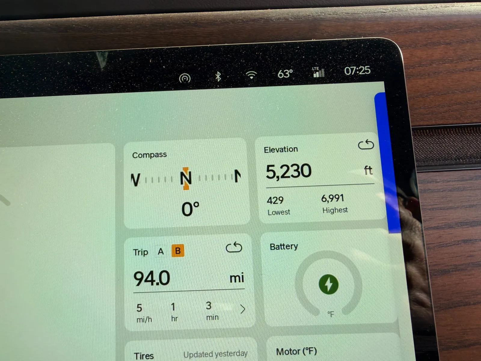 The Rivian R1T center display at Holbrook KOA showing Trip B 94.0 miles at 51 mph average over 1 hour 3 minutes moving time, elevation 5,230 ft, ambient 63°F at 7:25 AM