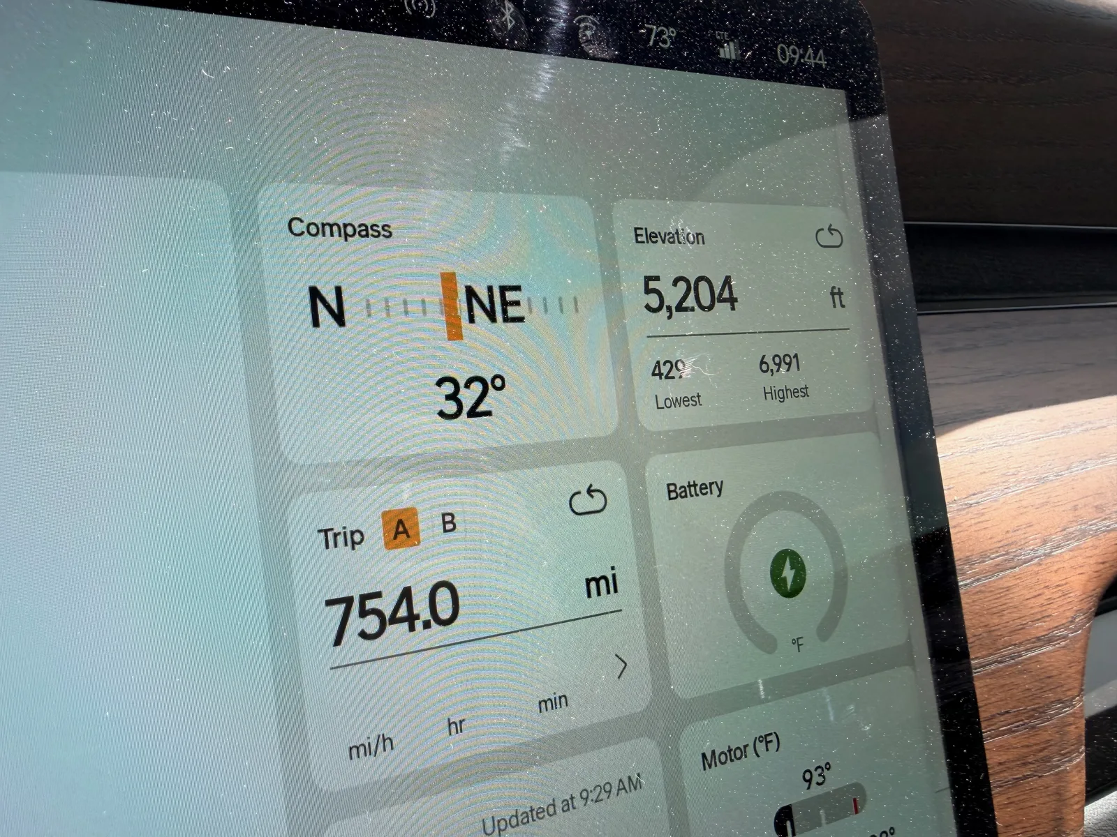 The Rivian R1T center display at the Holbrook RAN morning showing Trip A 754.0 miles, elevation 5,204 ft (lowest 429, highest 6,991), compass 32 degrees NE, ambient 73°F at 9:44 AM