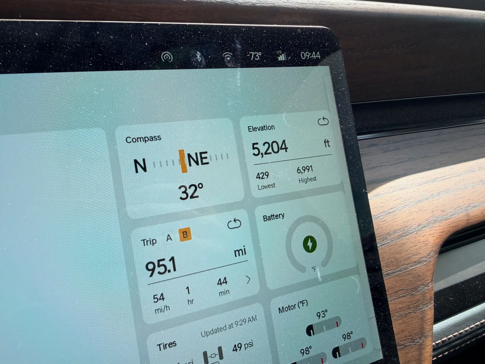 The Rivian R1T center display at the Holbrook RAN morning showing Trip B 95.1 miles at 54 mph in 1 hour 44 minutes, elevation 5,204 ft, ambient 73°F at 9:44 AM
