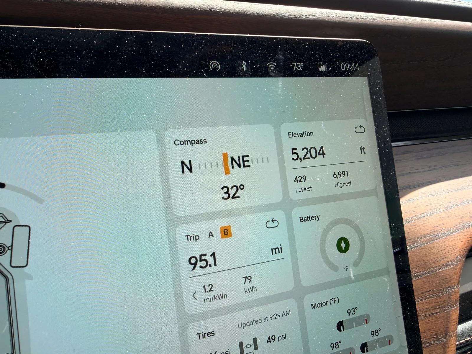 The Rivian R1T center display at the Holbrook RAN morning showing Trip B 95.1 miles at 1.2 mi/kWh and 79 kWh used, elevation 5,204 ft, ambient 73°F at 9:44 AM