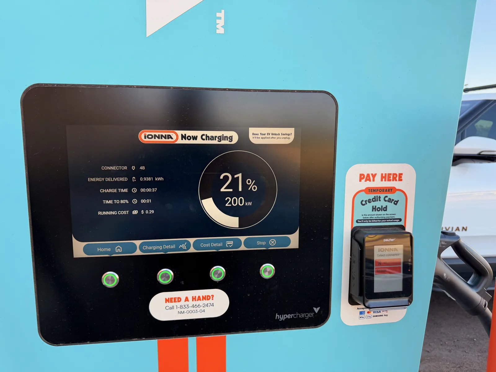 The IONNA pedestal screen 37 seconds into the session showing connector 4B, energy delivered 0.9381 kWh, charge time 00:00:37, time to 80% 00:01, running cost $0.29, state of charge 21%, current charging rate 200 kW with a circular gauge graphic, hyperCharger branding at the bottom