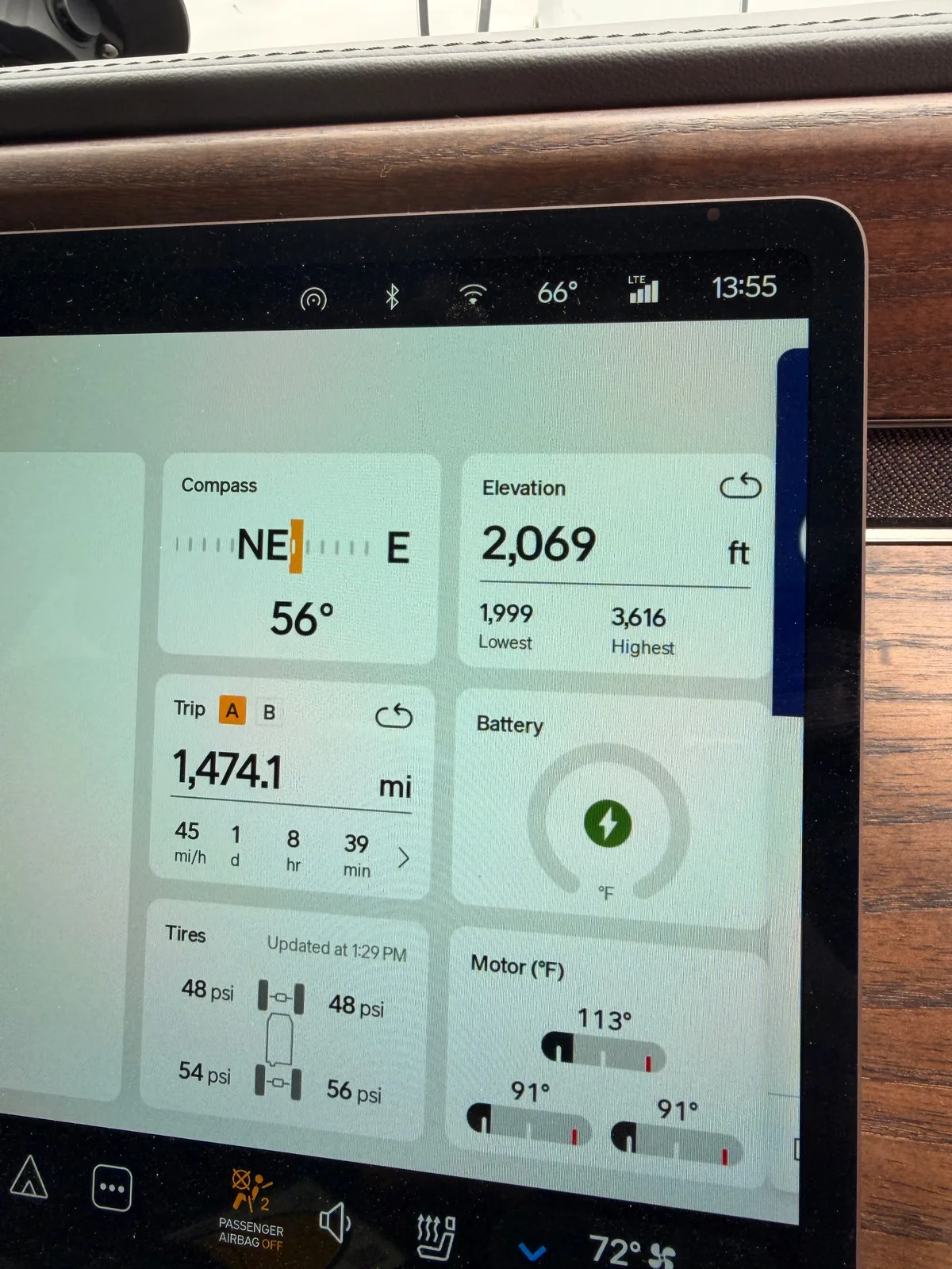 The Rivian R1T center display at the Erick OK Electrify America station Trip A cumulative view showing the full-trip mileage and energy at the Texas-Oklahoma border mid-day Day 6