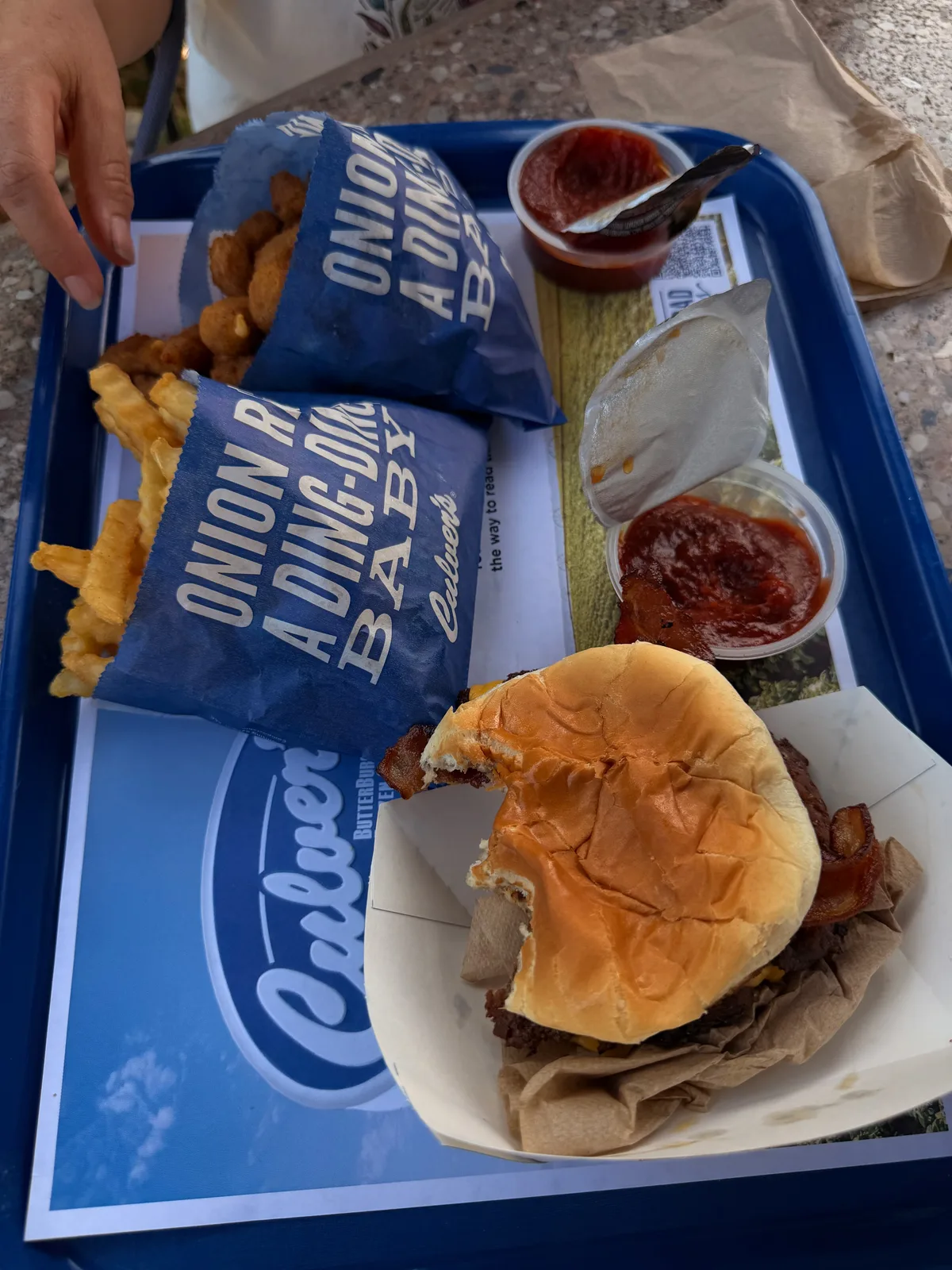 A Culver's tray with a double bacon cheeseburger and crinkle-cut fries and a drink, lunch at the St. Robert stop