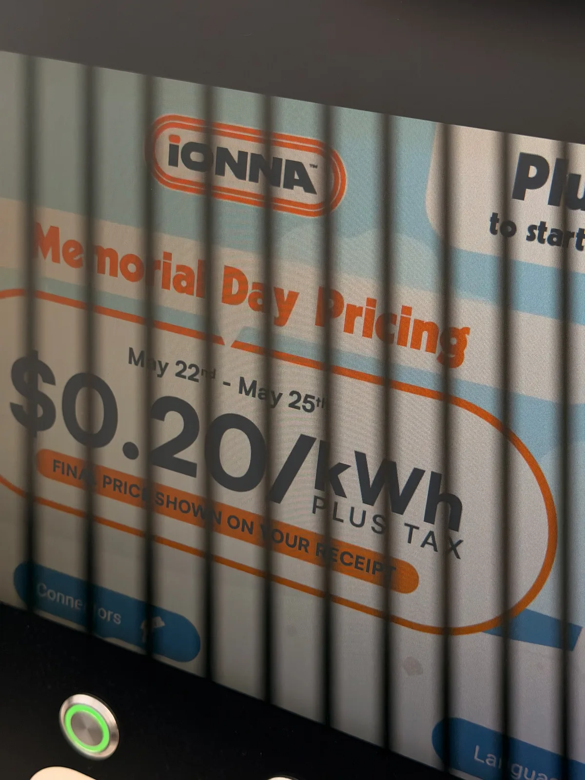 The IONNA charging-bay pricing board at Wally's in Fenton MO showing Memorial Day pricing from May 22 to May 25 at $0.20 per kWh plus tax