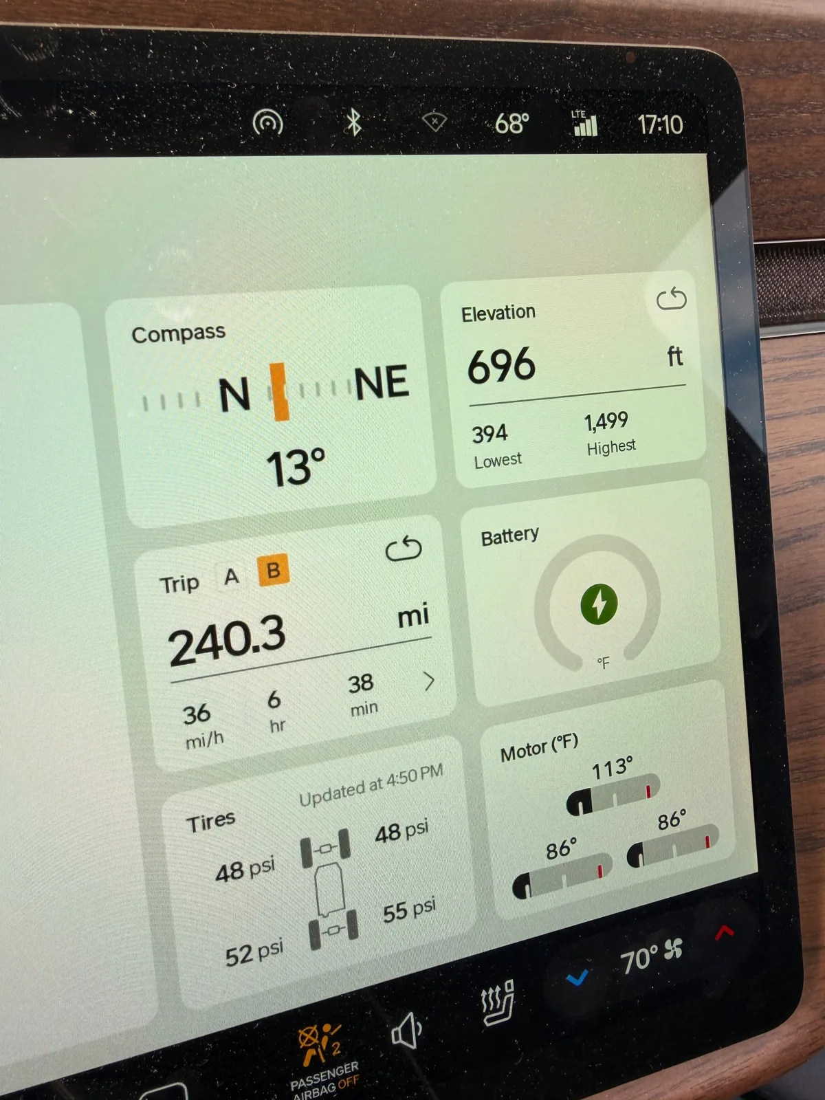 The Rivian R1T center display Trip B view at the Kenosha Tesla Supercharger showing Trip B 240.3 miles, 36 mph average, 6 hours 38 minutes moving time, elevation 696 ft