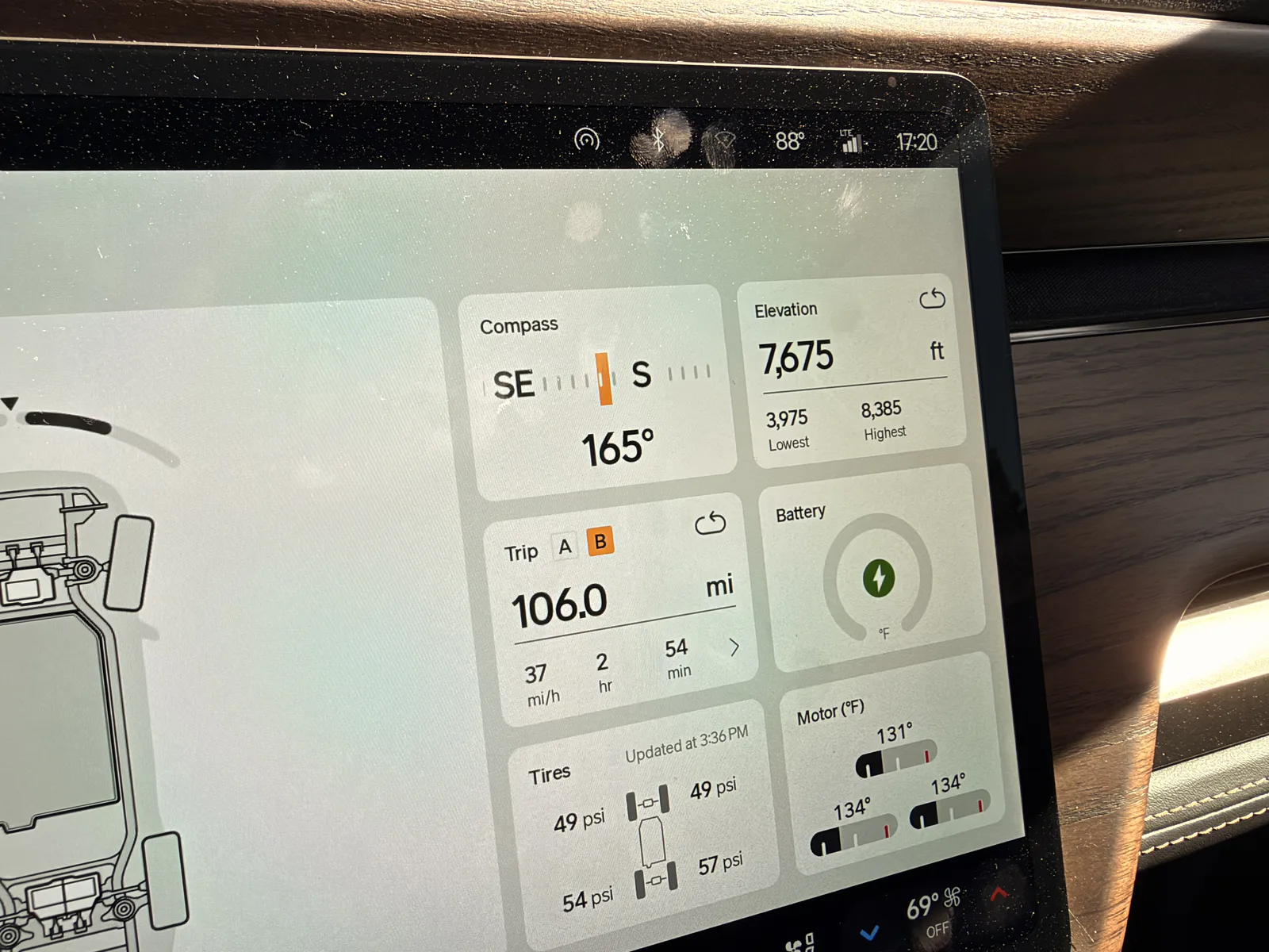 Rivian R1T center display at Ruby's Inn at 5:20 PM showing Trip B 106.0 miles at a 37 mph average over 2 hours 54 minutes, elevation 7,675 ft, tires 49 psi front and 54 and 57 psi rear