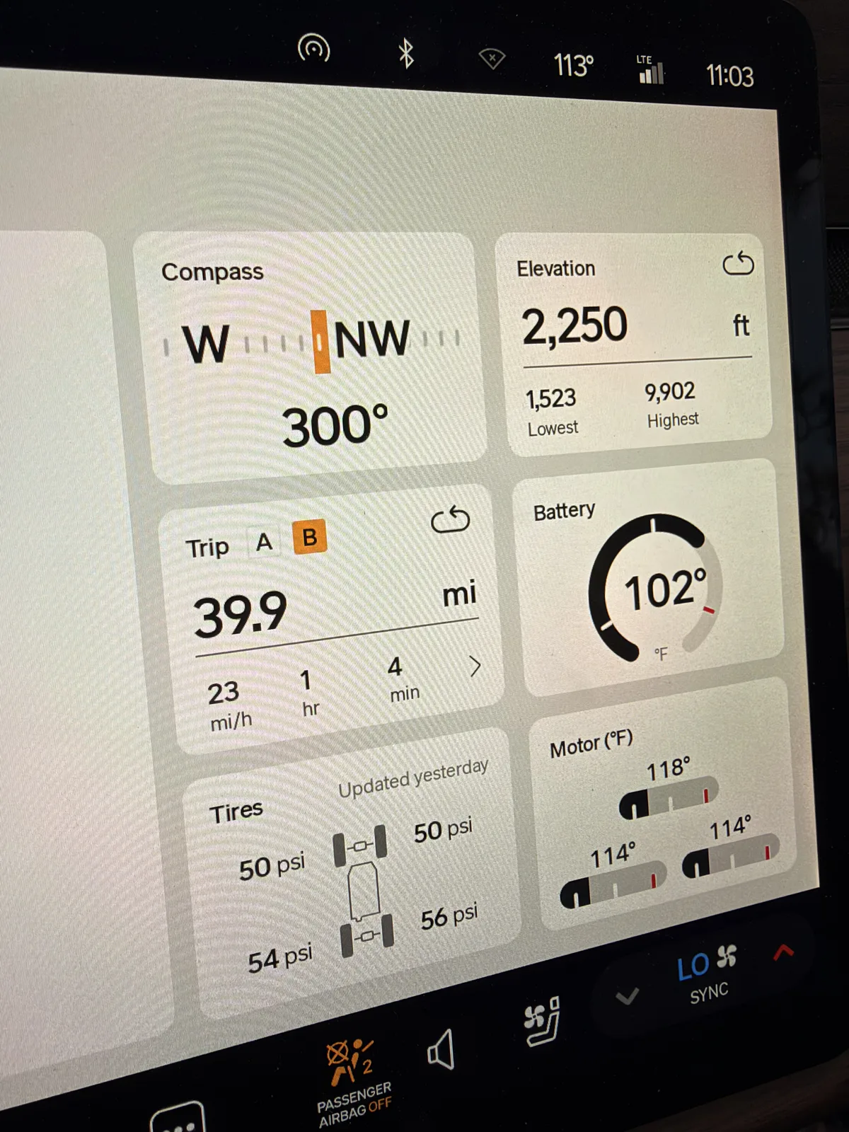Rivian R1T center display showing Trip B 39.9 miles at 23 mph average, elevation 2,250 ft, ambient 113 F, tires 50 to 56 psi