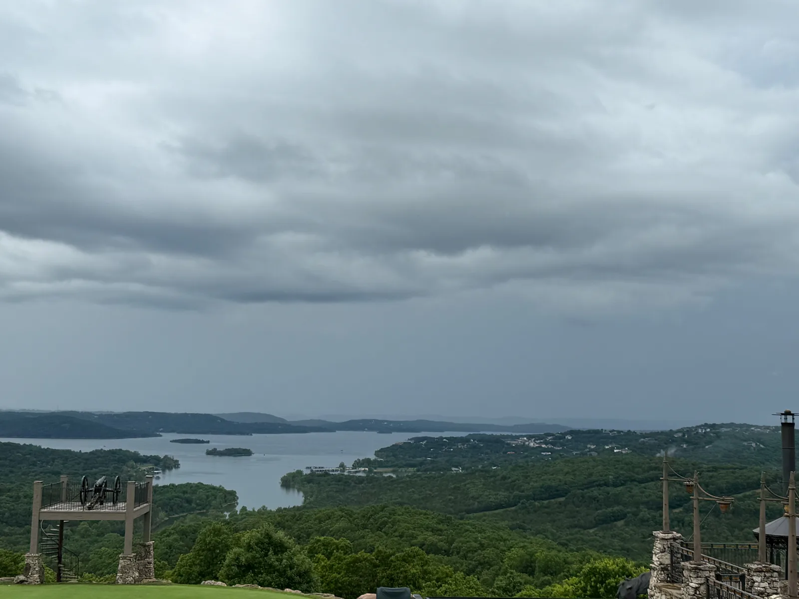 The sweeping view from Osage Restaurant at Big Cedar Lodge, Table Rock Lake and the wooded Ozark hills spreading out under dramatic storm clouds