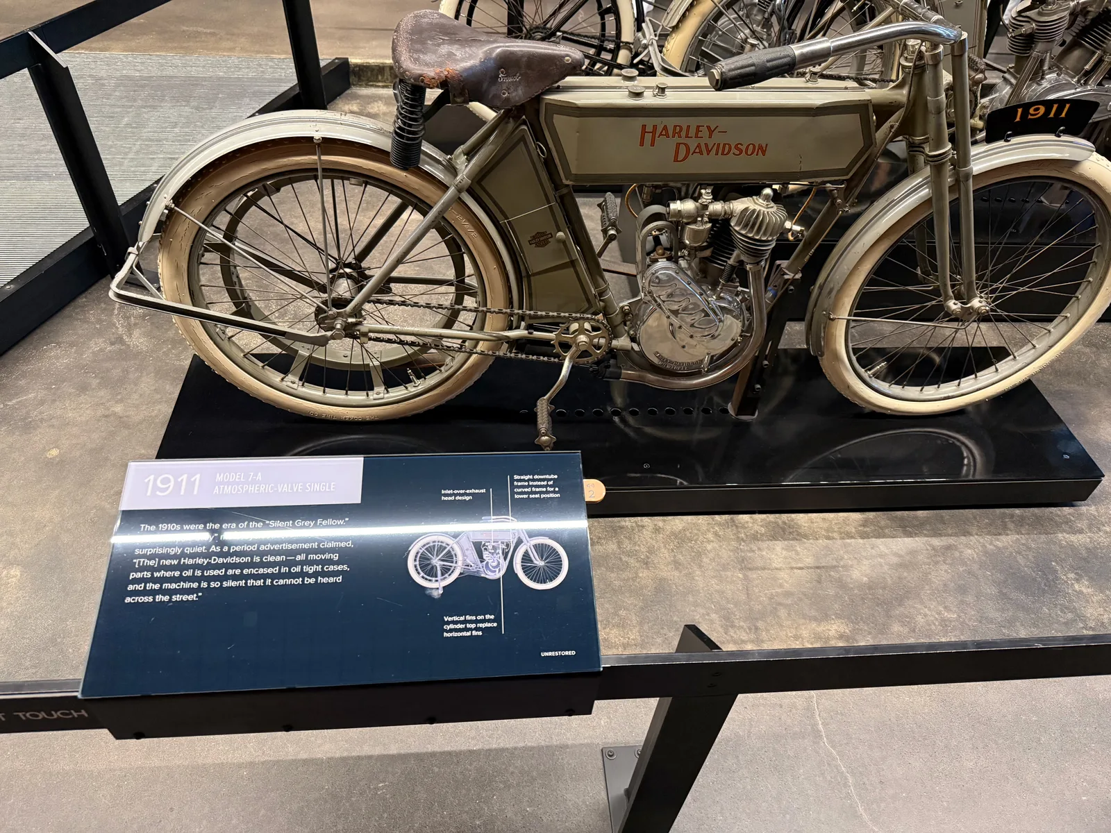 A 1911 Harley-Davidson Model 7-A atmospheric-valve single in original patina with its info placard at the Harley-Davidson Museum